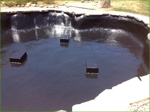 Pond coated black with PondPro 2000 and refilled with water after the main coat